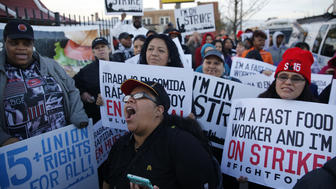 Nancy Salgado, center, leads chants outside a McDonald's in Chicago during a nationwide day of protests organized by the SEIU-backed Fight for $15 movement on Wednesday, April 15, 2015. (Michael Tercha/Chicago Tribune/TNS via Getty Images)