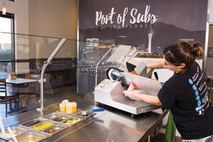 The slicer cuts the whole salami into pieces in a matter of seconds.