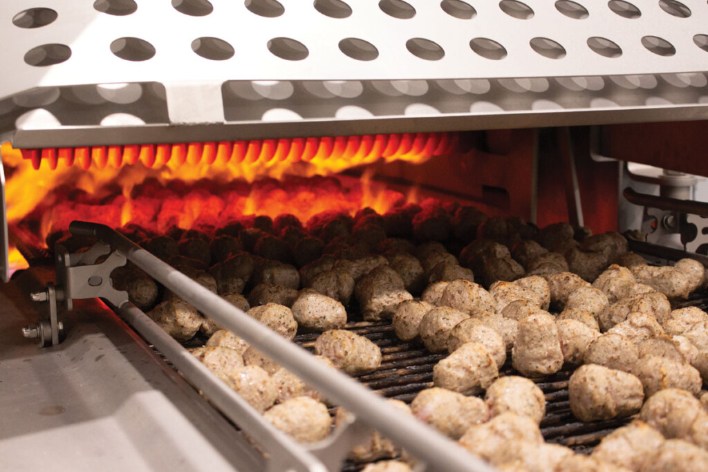 A flame grill sears grill marks onto meatballs at Kwik Trip