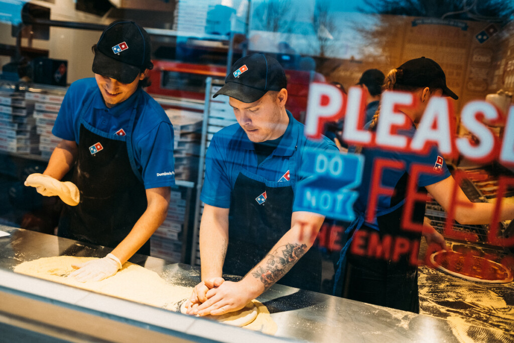 Workers prep pizza dough at a Domino's in Malmo, Sweden. Photo (Courtesy of Domino's) by Pierre Ekman/pierreekman.com