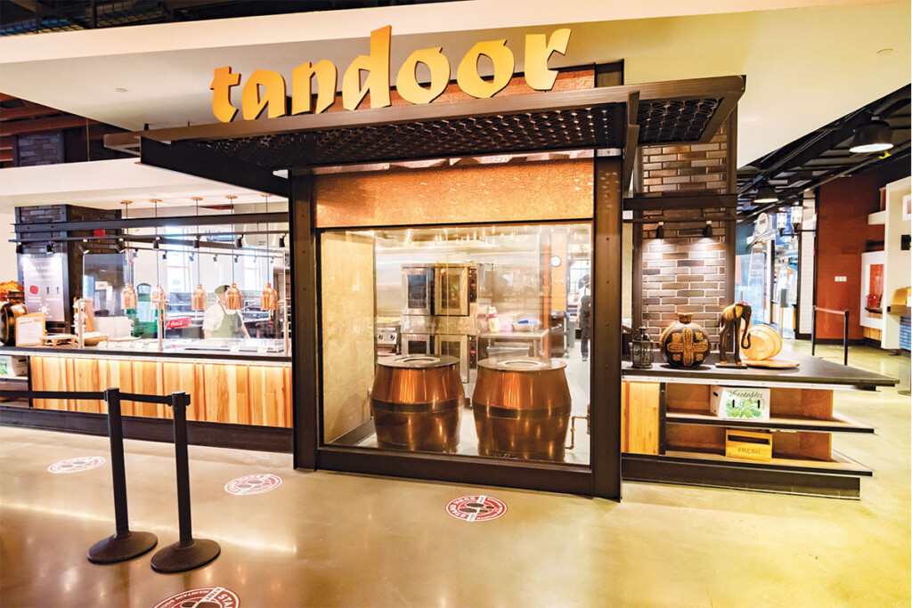 Twin copper-clad tandoor ovens anchor the Indian-food platform. Photos courtesy of Christopher Howland.