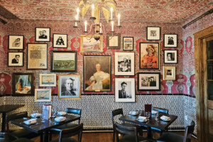 a dining area framed pictures