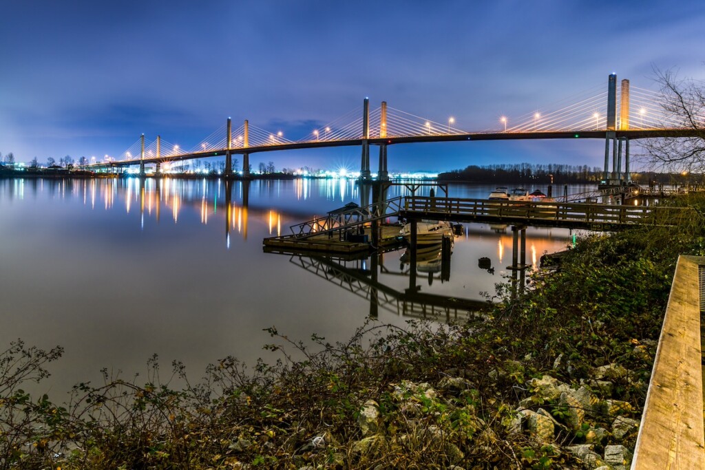 The Golden Ears Bridge, conecting Maple Ridge to Langley. Long exposure at night, reflecting into Fraser River.
